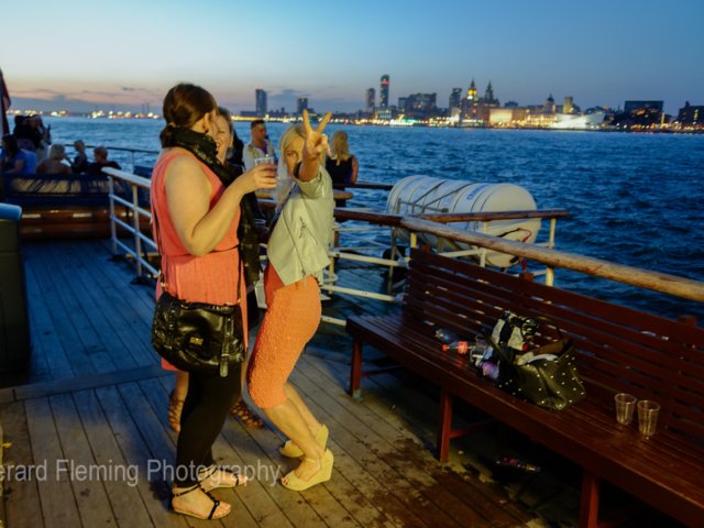 photo of people on ferry boat on river mersey
